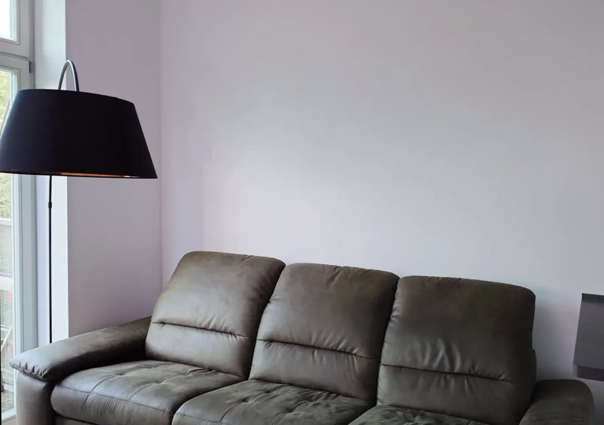 Empty wall above couch before gallery