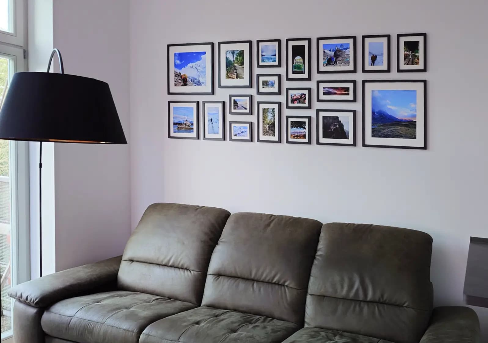Completed travel gallery above couch