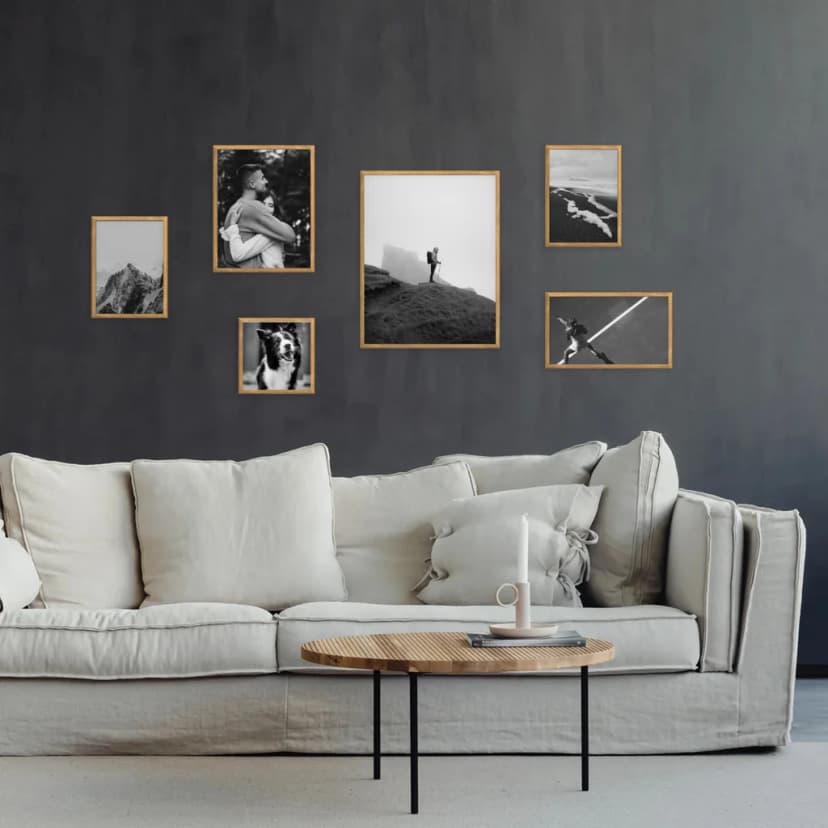 Gallery wall with frames arranged in ascending size order creating a stepping stone effect